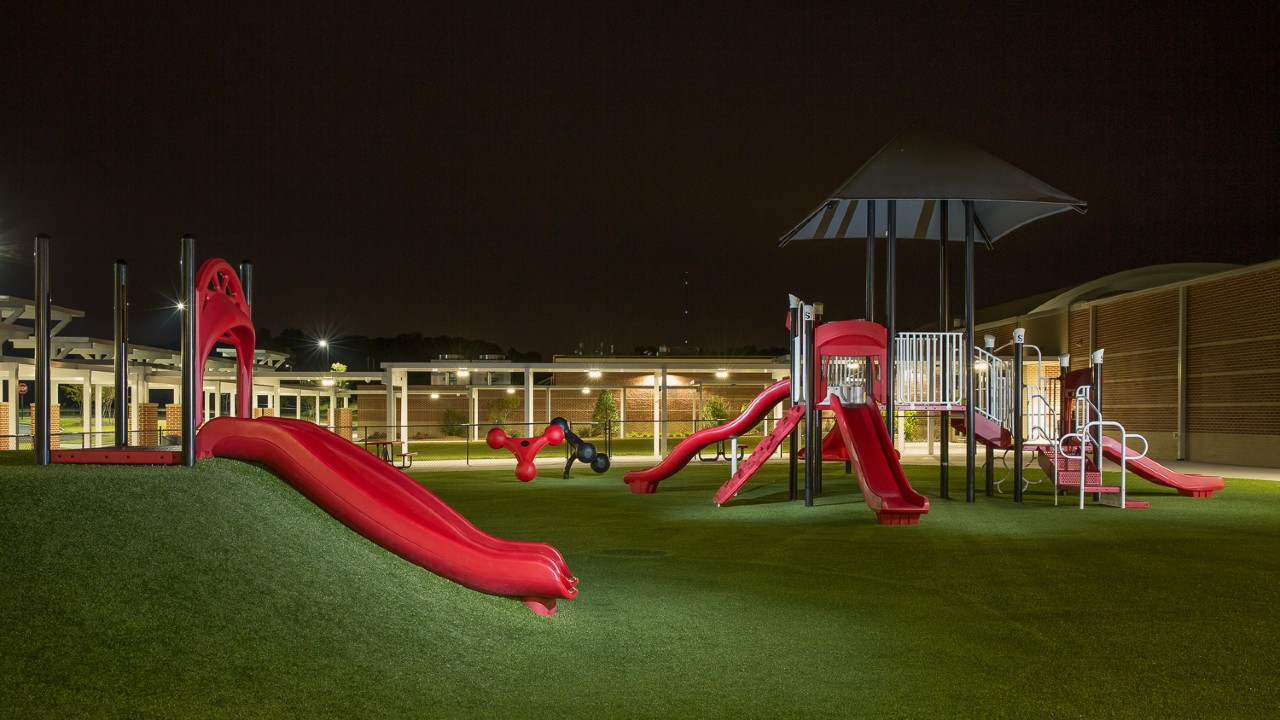Nighttime artificial turf playground by Southwest Greens of Tucson